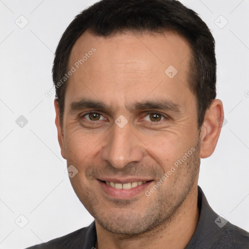 Joyful white adult male with short  brown hair and brown eyes