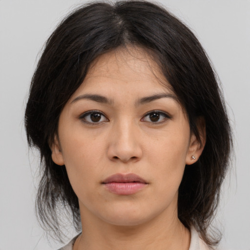 Neutral asian young-adult female with medium  brown hair and brown eyes