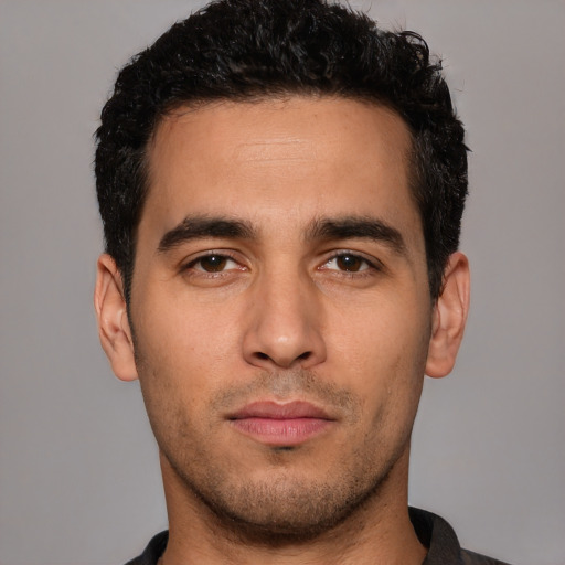 Neutral white young-adult male with short  black hair and brown eyes