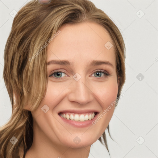 Joyful white young-adult female with long  brown hair and blue eyes