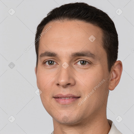 Joyful white young-adult male with short  brown hair and brown eyes