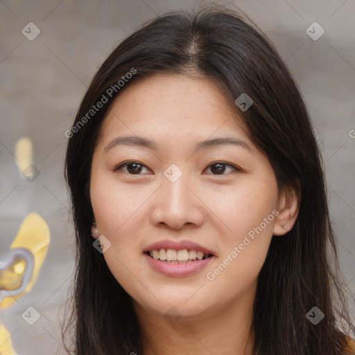 Joyful asian young-adult female with long  brown hair and brown eyes