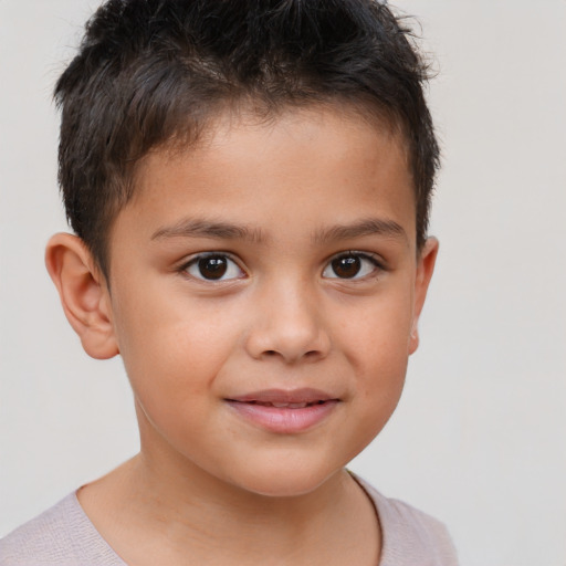 Joyful white child male with short  brown hair and brown eyes