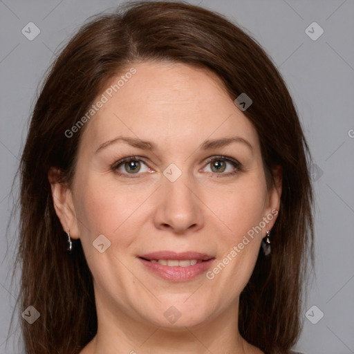 Joyful white adult female with medium  brown hair and grey eyes