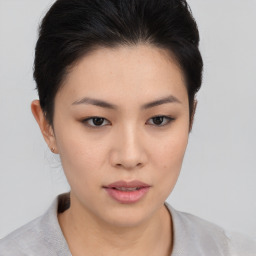 Neutral asian young-adult female with medium  brown hair and brown eyes