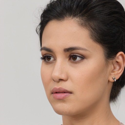 Neutral latino young-adult female with medium  brown hair and brown eyes