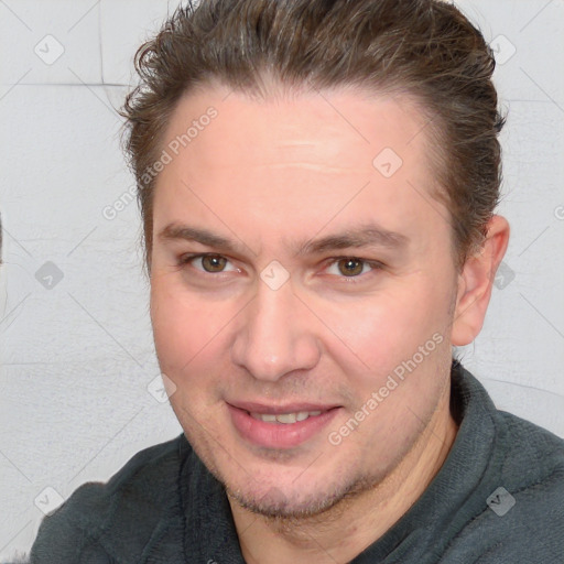 Joyful white adult male with short  brown hair and brown eyes