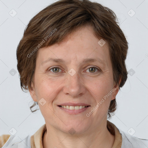 Joyful white adult female with short  brown hair and brown eyes