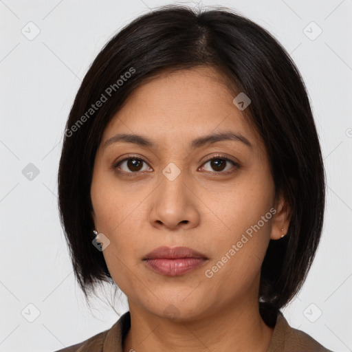 Joyful latino young-adult female with medium  brown hair and brown eyes