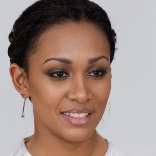 Joyful latino young-adult female with short  brown hair and brown eyes