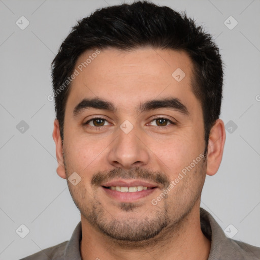 Joyful white young-adult male with short  black hair and brown eyes