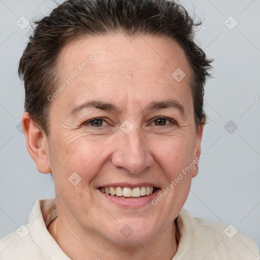 Joyful white adult female with short  brown hair and brown eyes