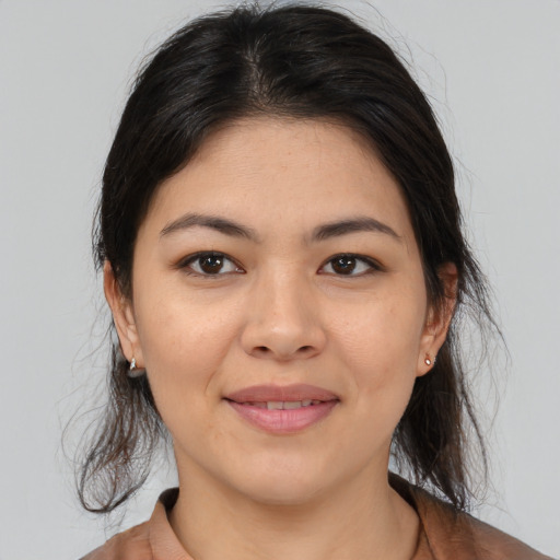 Joyful asian young-adult female with medium  brown hair and brown eyes