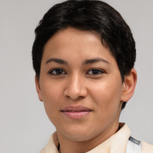 Joyful latino young-adult female with short  brown hair and brown eyes