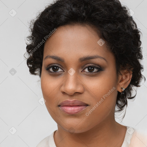 Joyful black young-adult female with medium  brown hair and brown eyes