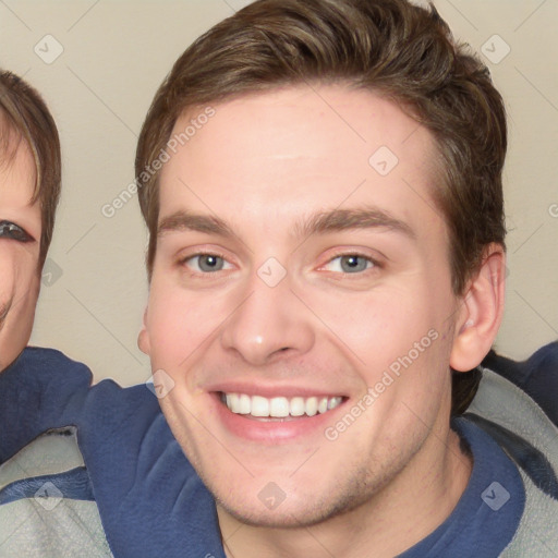 Joyful white young-adult male with short  brown hair and blue eyes