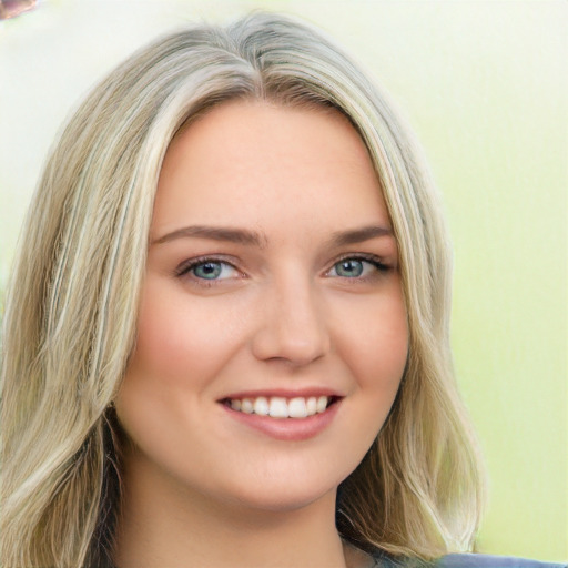 Joyful white young-adult female with long  brown hair and green eyes