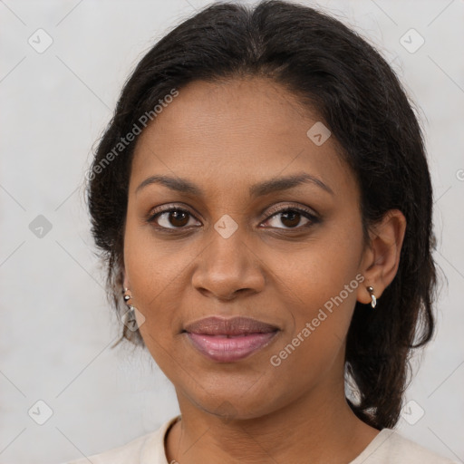 Joyful black young-adult female with medium  brown hair and brown eyes