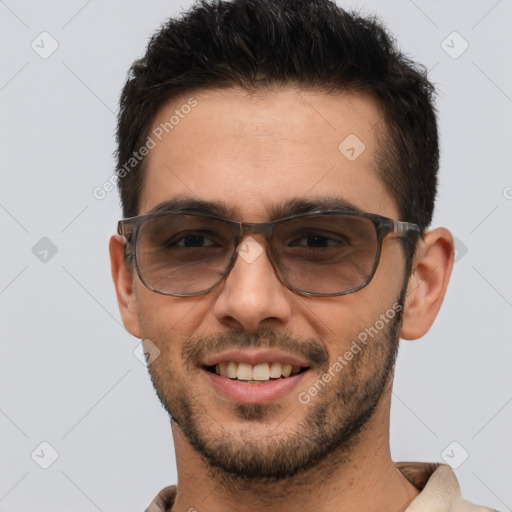 Joyful white young-adult male with short  brown hair and brown eyes