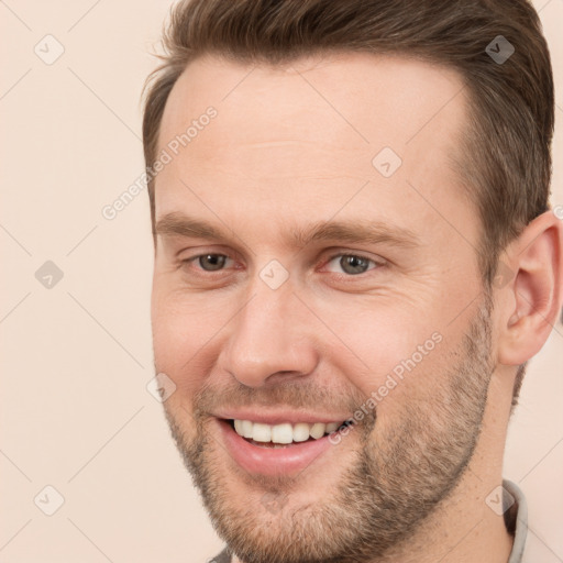 Joyful white adult male with short  brown hair and brown eyes