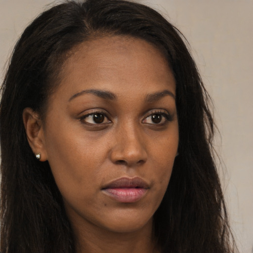 Neutral black young-adult female with long  brown hair and brown eyes