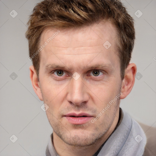 Joyful white adult male with short  brown hair and grey eyes