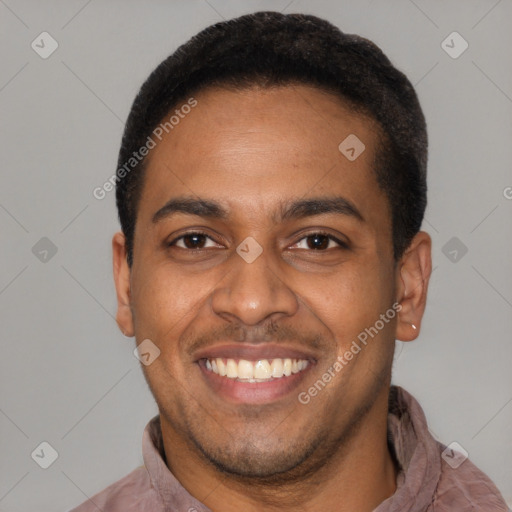 Joyful latino young-adult male with short  brown hair and brown eyes