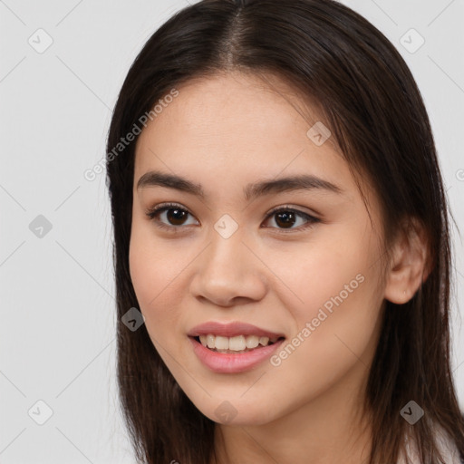 Joyful white young-adult female with long  brown hair and brown eyes