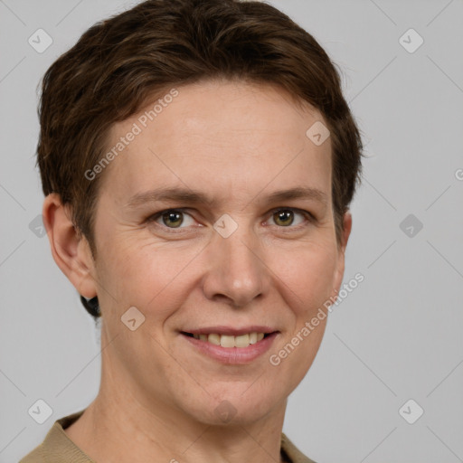 Joyful white adult female with short  brown hair and grey eyes