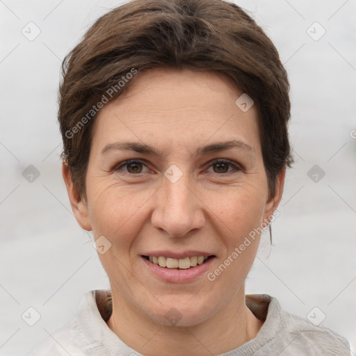 Joyful white adult female with short  brown hair and brown eyes