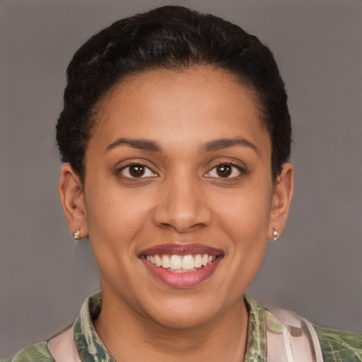 Joyful latino young-adult female with short  brown hair and brown eyes