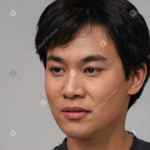 Joyful asian young-adult male with short  black hair and brown eyes