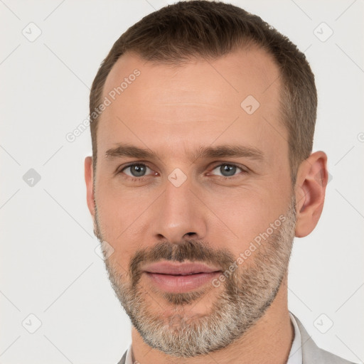 Joyful white adult male with short  brown hair and brown eyes