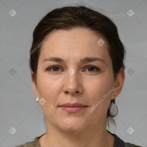 Joyful white adult female with medium  brown hair and grey eyes