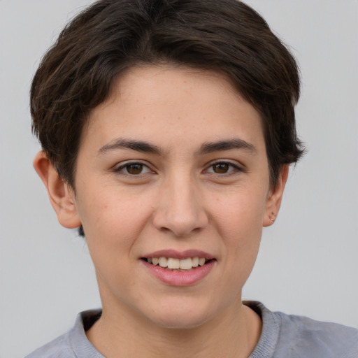 Joyful white young-adult female with short  brown hair and brown eyes