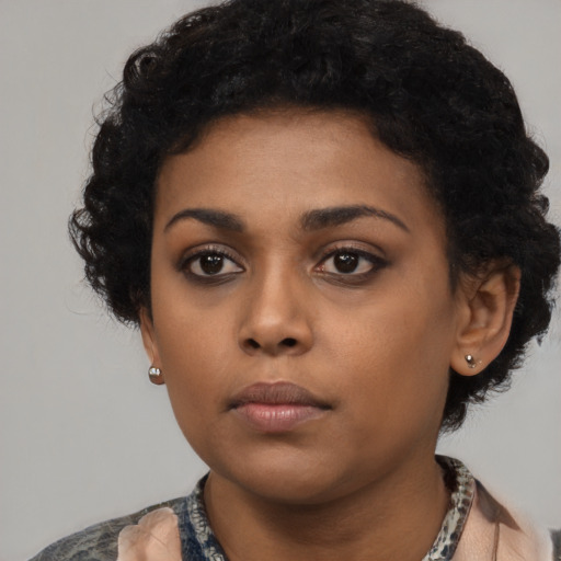 Neutral black young-adult female with short  black hair and brown eyes