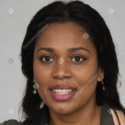 Joyful black young-adult female with long  brown hair and brown eyes