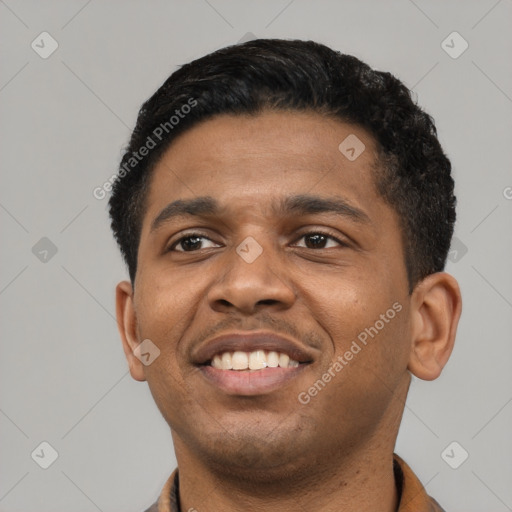 Joyful latino young-adult male with short  black hair and brown eyes