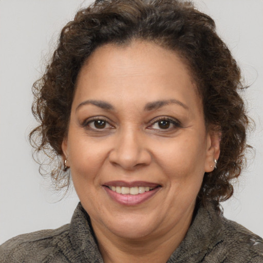 Joyful white adult female with short  brown hair and brown eyes