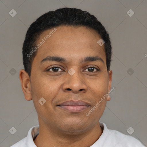 Joyful black young-adult male with short  black hair and brown eyes