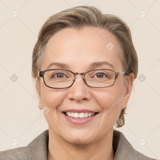 Joyful white adult female with medium  brown hair and grey eyes