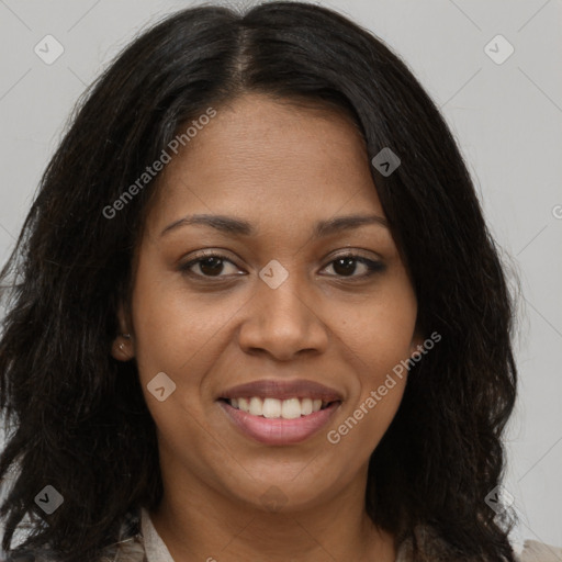 Joyful black young-adult female with long  brown hair and brown eyes