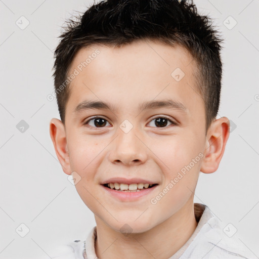 Joyful white child male with short  brown hair and brown eyes