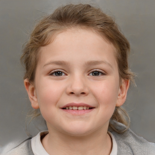 Joyful white child female with medium  brown hair and brown eyes