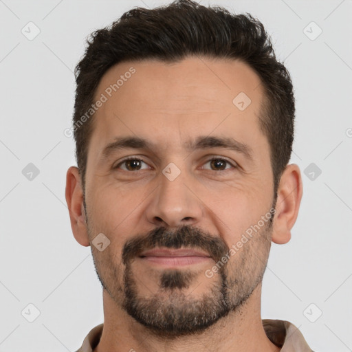 Joyful white adult male with short  brown hair and brown eyes