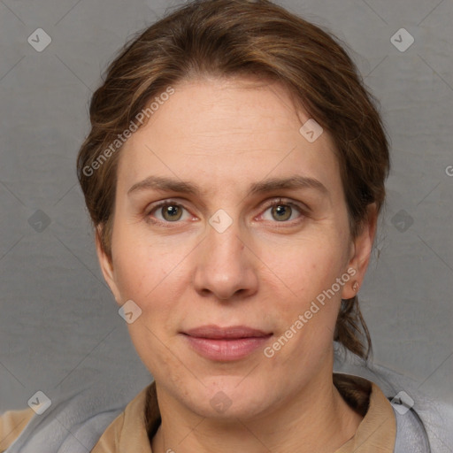 Joyful white adult female with short  brown hair and grey eyes