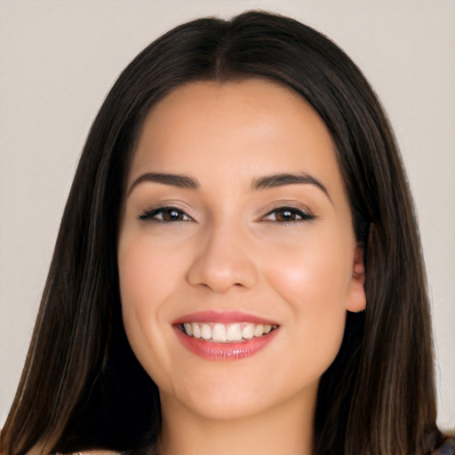 Joyful white young-adult female with long  black hair and brown eyes