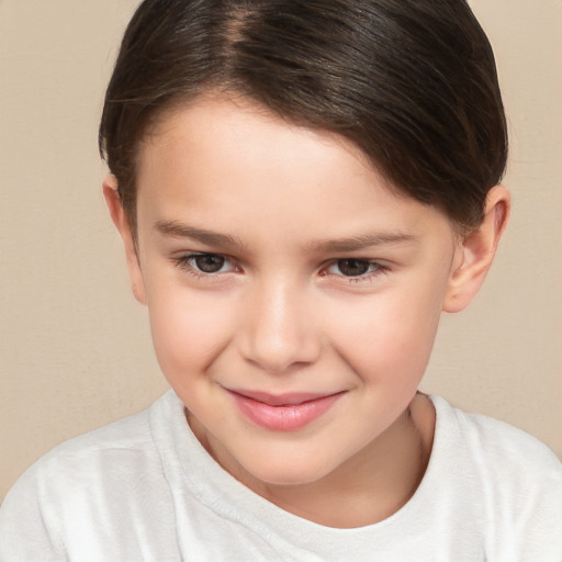 Joyful white child female with short  brown hair and brown eyes