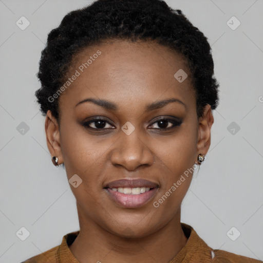 Joyful black young-adult female with short  black hair and brown eyes
