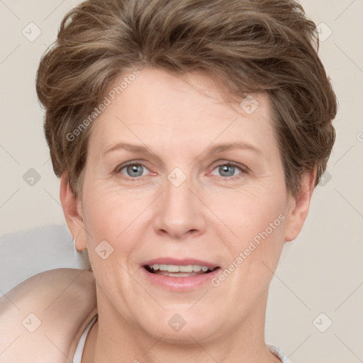 Joyful white adult female with short  brown hair and grey eyes